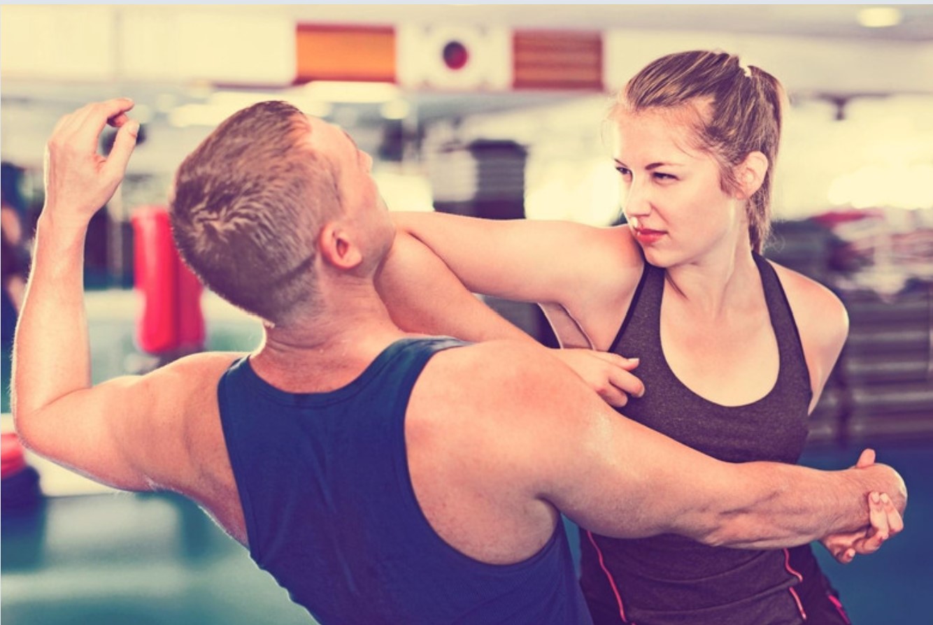 Woman practicing self-defense